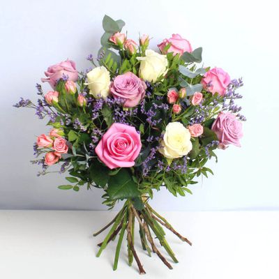 Our gorgeous arrangement of mixed roses has flashes of lilac and pink, perfectly modest and equally stunning. Can't find the words? Say it with this cute bunch of demure blooms... With same day delivery these are the perfect last minute Mother's Day flowers. This bouquet will be handcrafted by an experienced florist, and delivered by hand.